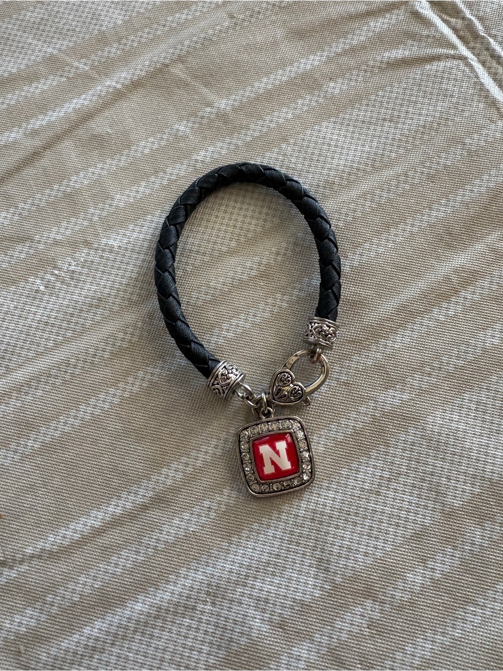 Black Braided Leather Bracelet with Red 'N' Charm